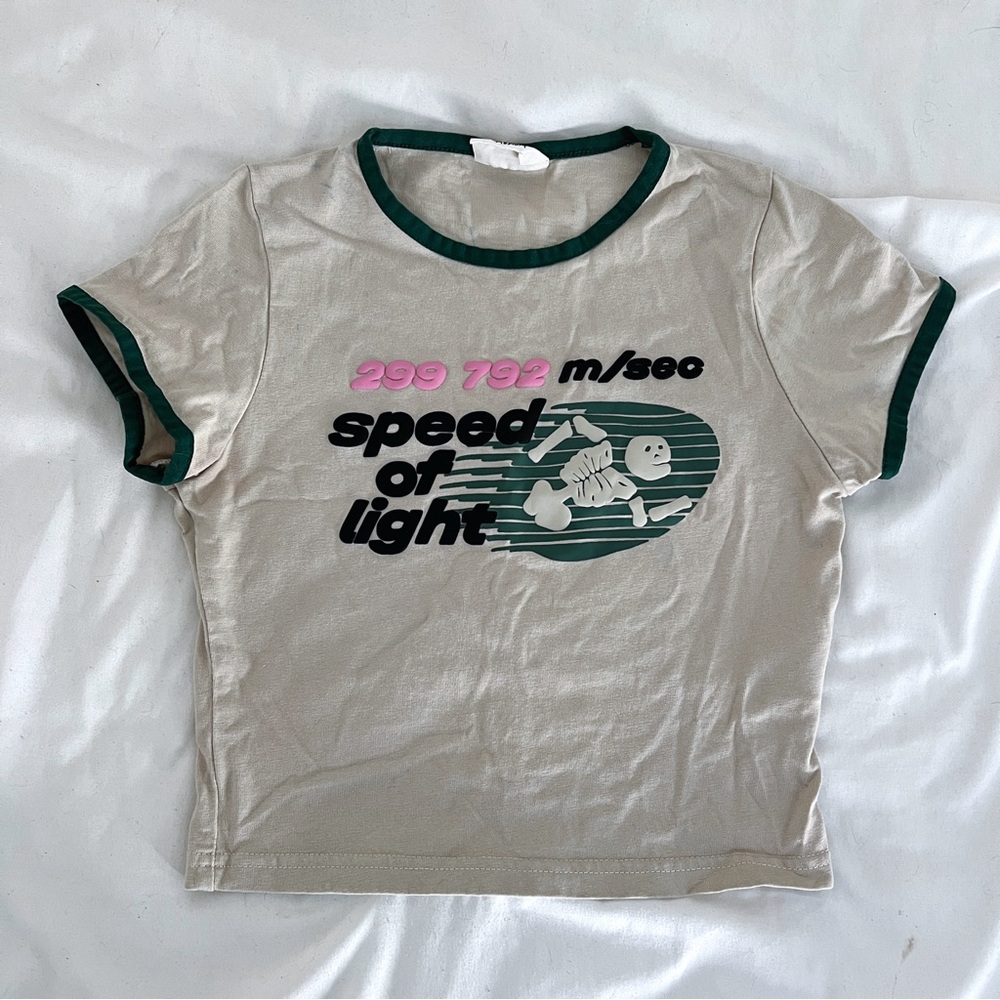 SOLD 🫶🏽 BROKEN PLANET BABY TEE